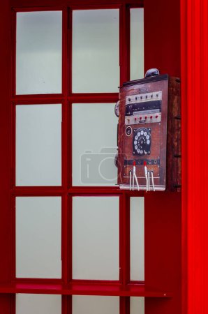 Timisoara, Romania - October 29, 2016: Red, telephone public payphone in the center of Timisoara, Romania