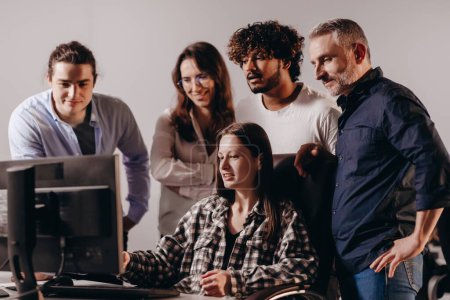Photo for Business team working on project together. Group of web developers looking at computer screen. Coworkers solving difficult task. Brainstorming, teamwork. High quality photo - Royalty Free Image