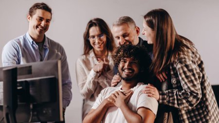 Photo for Friendly atmosphere in office. Happy coworkers celebrating successful ideas. Startup teamwork. Group of managers laughing during work process. High quality photo - Royalty Free Image