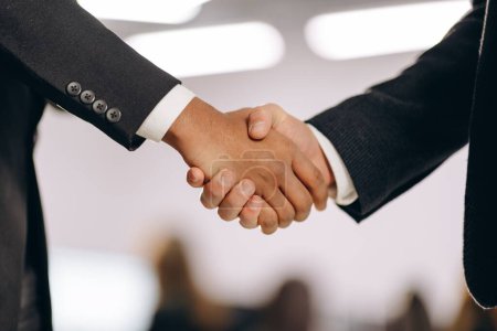 Foto de Business partners shaking hands. Handshake of businessmen after successful meeting. Business deal, agreement concept. High quality photo - Imagen libre de derechos