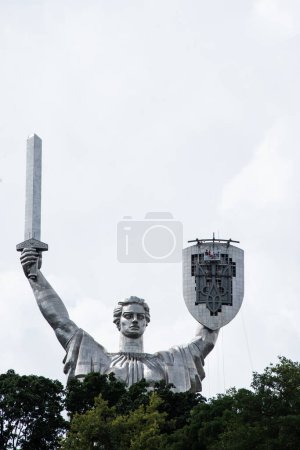 Photo for Kyiv, Ukraine - Aug 2023 : Motherland or Mother Ukraine monument. new replaced trident, Ukrainian national symbol, coat of arms, which was installed instead of the Soviet Union coat of arms. High - Royalty Free Image