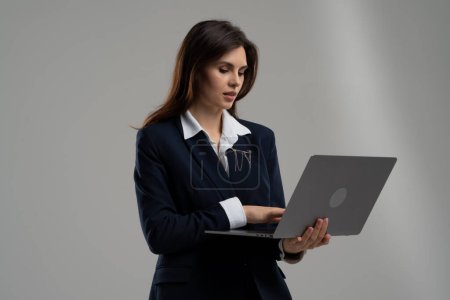 Photo for Confident businesswoman using computer creating presentation. Young woman working on laptop. Business analytic doing her job remotely. Ceo answering email letters. High quality photo - Royalty Free Image