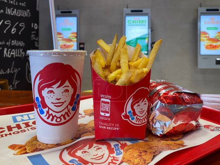 Photo for Close-up of french fries, drink and Burger on a tray at Wendys fast food restaurant: Batumi, Georgia, July 14, 2023. - Royalty Free Image