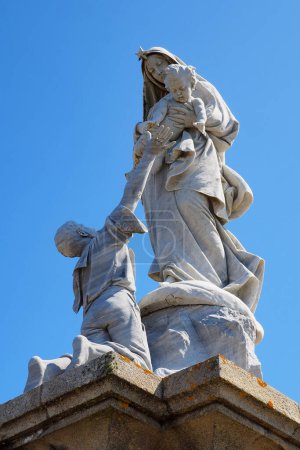 Photo for Located near the Pointe du Raz semaphore, Notre-Dame des Naufrages is a public domain sculpture that pays tribute to the men and women lost at sea. It was made by Cyprien Godebski in 1904 - Royalty Free Image