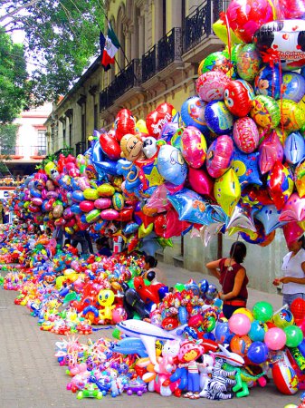 Photo for Itinerant seller of multicolored balloons in a street in Mexico City, not far from the Constitution Square familiarly nicknamed the Zocalo - Royalty Free Image