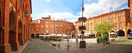 Photo for Panoramic view of Place Nationale is a square located in the city of Montauban in France. Rebuilt in the 17th century after two fires, this is the heart of the city - Royalty Free Image