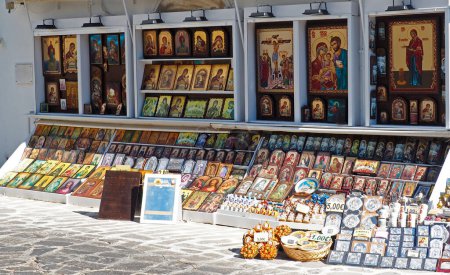 Photo for Store of icons and religious objects in the main street of Tinos (Greece), at the foot of the superb Panagia Evangelistria cathedral overlooking the city, on this famous and beautiful island of the Cyclades archipelago - Royalty Free Image