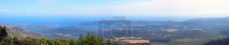 panoramic view of the eastern coast of Corsica, nicknamed the Isle of Beauty, from the charming belvedere village of Prunelli. We see a large part of the plain, the island of Elba and Montecristo. On a clear day mainland Italy can be seen