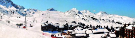 Panoramic view of the snow front and the ski area of the famous Belle-Plagne ski resort in the heart of the French Alps in the Tarentaise valley at the foot of Mont Blanc