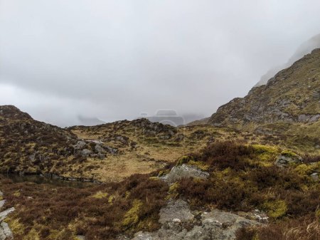 Photo for Serene Mountain Wilderness Under Skies of Gray. Hiking to Glyder Fawr in the mist, Snowdonia - Royalty Free Image