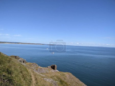 Photo for Welsh coastal shore with breathtaking horizon over blue ocean. - Royalty Free Image