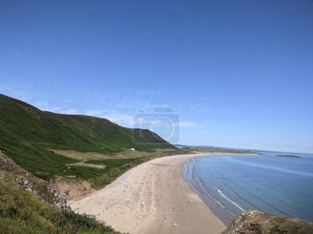 Photo for Coastal landscape at Rhosilli Bay with blue sea and sky. View of coast, beach and sea - Royalty Free Image