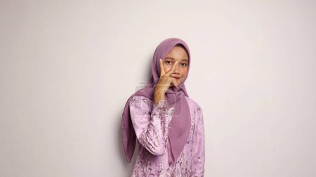 Photo for Beautiful Indonesian teenage girls wearing kebaya and hijab on an isolated white background - Royalty Free Image