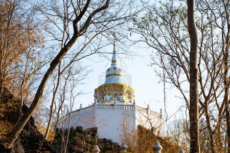 Téléchargez les photos : White pagoda with stair walkway at Tham Phra Sabai temple, Lampang province. - en image libre de droit