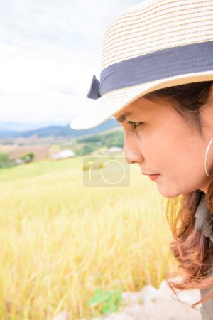 Photo for Face of Asian Woman with Rice Field Background at Pa Bong Piang Rice Terraces, Chiangmai Province. - Royalty Free Image
