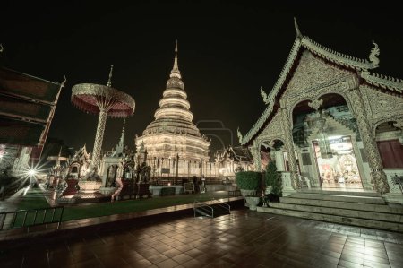 Photo for Night scene of Phra That Hariphunchai temple, Lamphun Province. - Royalty Free Image