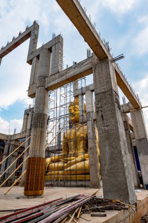Photo for Golden Buddha statue under construction at Ban Den temple, Chiang Mai province. - Royalty Free Image