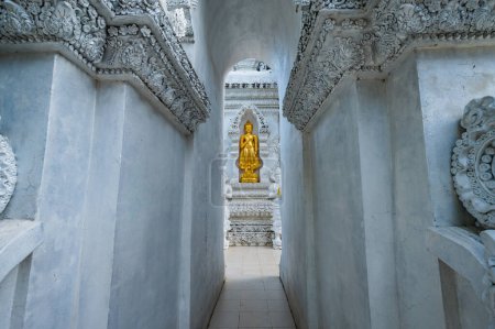 Photo for Temple entrance and golden Buddha statue at San Pa Yang Luang temple, Lamphun province. - Royalty Free Image