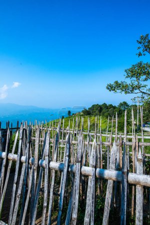 Photo for Bamboo fence with mountain view at Doi Chang Mub base, Chiang Rai province. - Royalty Free Image