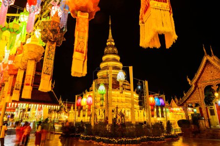 Photo for LAMPHUN, THAILAND - October 28, 2020 : Phra That Hariphunchai Pagoda with Lanna Style Lantern at Night, Lamphun Province. - Royalty Free Image