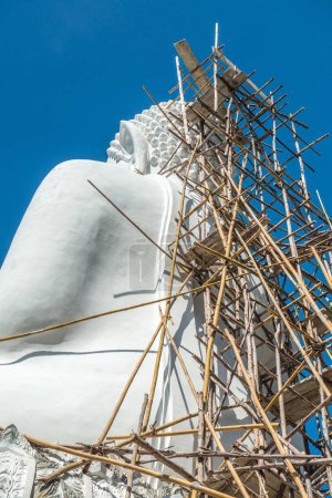 Photo for White buddha statue under construction at Phra That Maeyen temple, Thailand. - Royalty Free Image