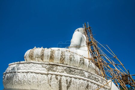 Photo for White buddha statue under construction at Phra That Maeyen temple, Thailand. - Royalty Free Image