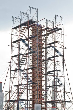 Photo for Column with scaffolding in construction site, Thailand. - Royalty Free Image