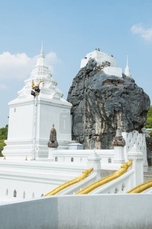 White pagoda and big stone at Phra Phutthabat temple, Thailand