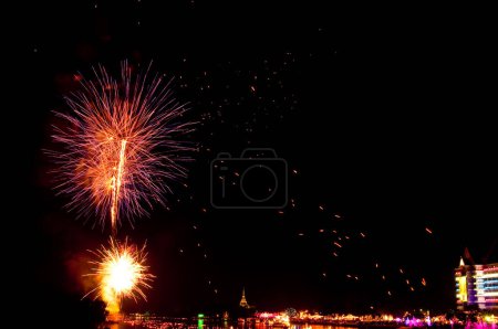 Colorful Fireworks in night at Bangpakong river, Chachoengsao province, Thailand.