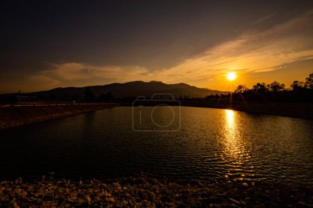 Reservoir with mountain view at sunset, Chiang Mai province.