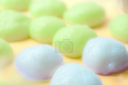 Freshly made white mochi on the food stall. This Japanese snack is made from chewy dough and has a smooth taste, suitable for eating with soft drinks.