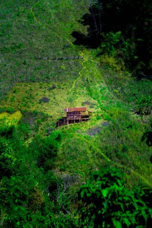 A small hut that is simply built amidst the complex mountains of Nan Province, Thailand.