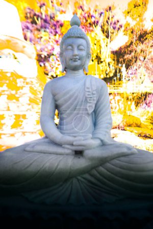 White Buddha statue in a meditation center at Lampang Province, Thailand.
