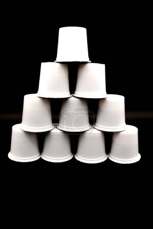 Foto de Coffee k-cups stacked in a pyramid shape. - Imagen libre de derechos