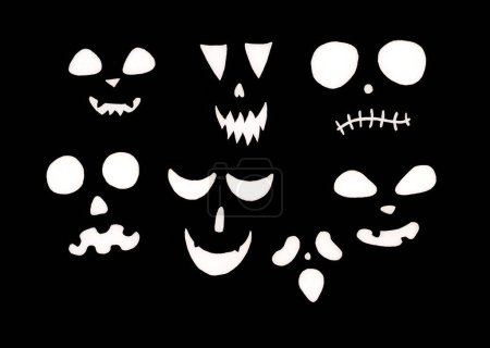 Photo for Set of different scary and funny facial expressions in white color on black background. Halloween. All faces consist of silhouettes of eyes, nose and mouth. Geometric shapes. - Royalty Free Image