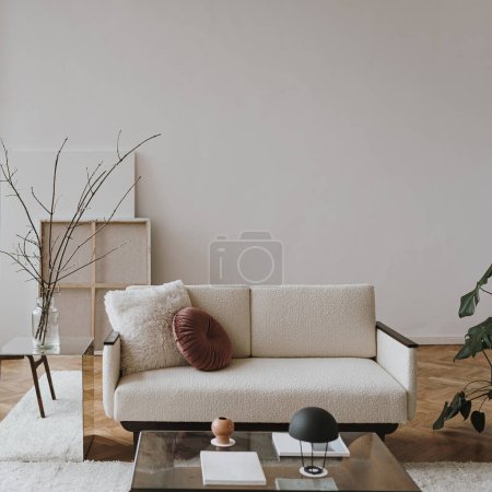 Photo for Aesthetic modern Scandinavian home interior design. Elegant living room with comfortable sofa, mid-century furniture, cozy carpet, wooden floor, white walls, home plants - Royalty Free Image
