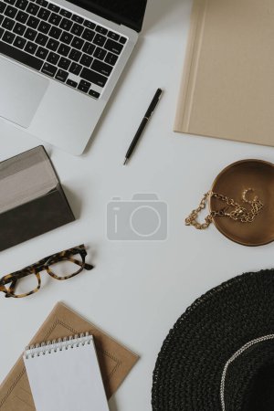 Photo for Aesthetic bohemian fashion online store, shop concept with blank copy space for branding. Flatlay laptop computer, fashionable women's bijouterie, jewelry, accessories on white table - Royalty Free Image