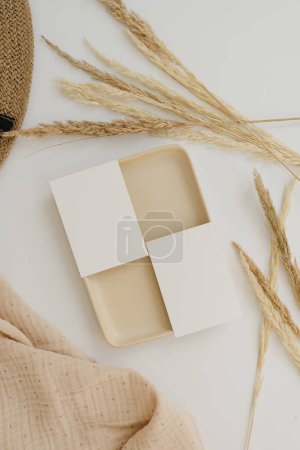 Photo for Blank paper sheet cards with mockup copy space. Pampas grass stems, muslin cloth. Aesthetic bohemian minimal business brand template. Flat lay, top view - Royalty Free Image