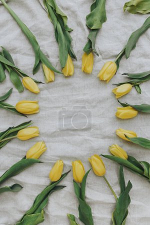 Photo for Wreath made of elegant yellow flowers with blank mockup copy space on beige crumpled linen cloth. Flat lay, top view brand, blog, website, social media template - Royalty Free Image