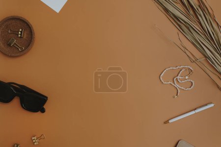 Photo for Flatlay blank frame with copy space. Minimal aesthetic women's summer fashion accessories on orange background. Top view, flat lay - Royalty Free Image