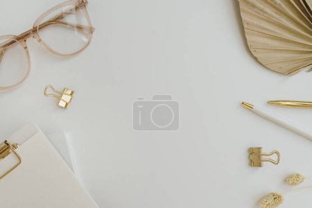Blank mockup copy space frame template. Aesthetic stylish golden female office stationery accessories on white background. Flatlay, top view