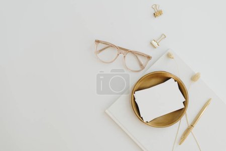 Photo for Aesthetic luxury bohemian branding or invitation card template. Blank paper invitation card sheet with empty mock up copy space, glasses, album on white background - Royalty Free Image