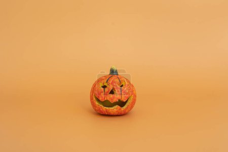 Photo for Halloween pumpkin on orange background - Royalty Free Image