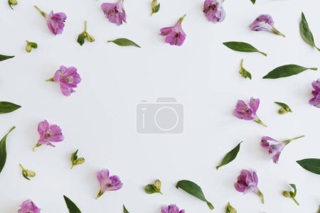 Photo for Blank frame with blank mockup copy space made of elegant purple violet flowers and leaves. Flat lay, top view brand, blog, website, social media template - Royalty Free Image