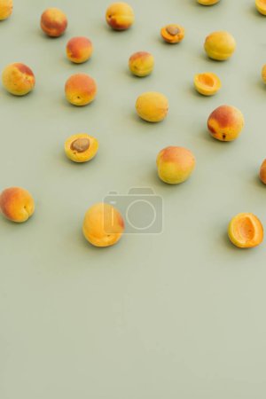 Photo for Aesthetic fruit background. Ripe juicy peaches on pastel green background. Fresh organic fruit vegan food - Royalty Free Image