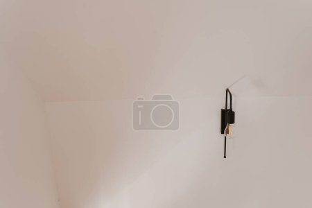 Photo for Wall light lamp on white wall - Royalty Free Image