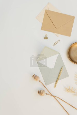 Photo for Aesthetic wedding invitation card in envelope. Flat lay, top view holiday event celebration. Blank mockup copy space - Royalty Free Image