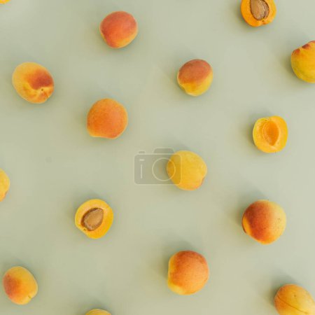 Photo for Flat lay with ripe peaches on neutral pastel green surface - Royalty Free Image