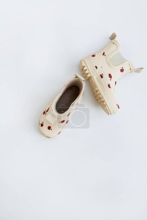 Photo for Beige children's rubber boots, rain boots. Baby fashion - Royalty Free Image