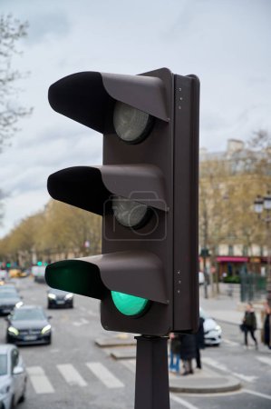 Traffic light turning green, close-up, Paris